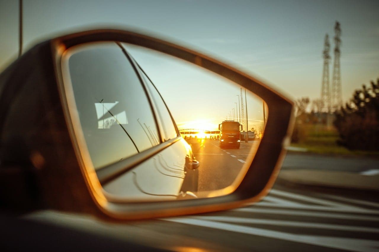 Door mirror catching the evening sun